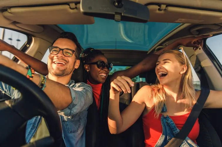 Happy travelers carpooling in Lombok